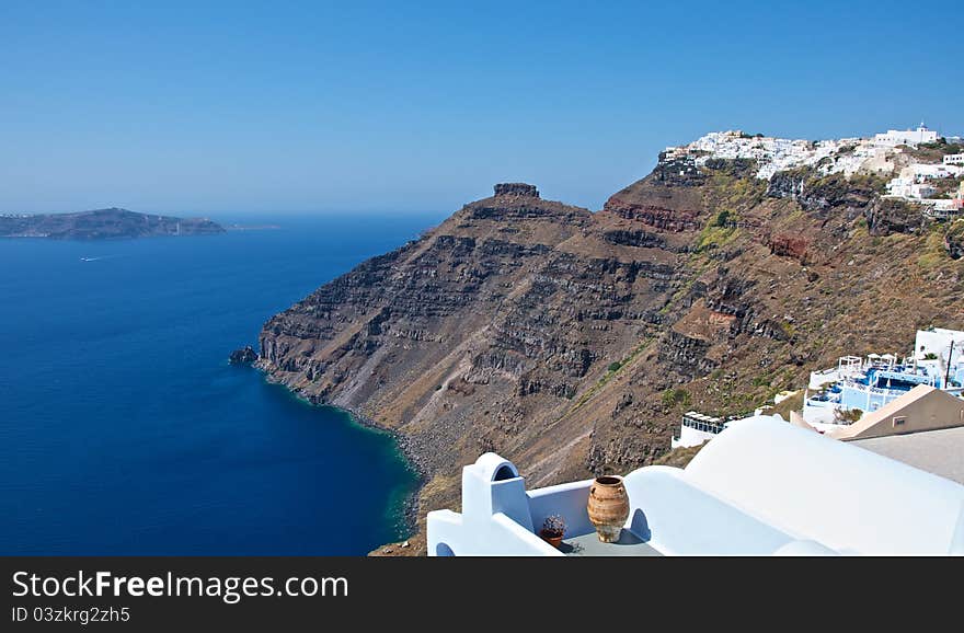 With snow-white terraces with amazing views. In the distant mountains are visible islands, the blue Mediterranean Sea stretches to the horizon and blue sky envelops the barely perceptible haze. With snow-white terraces with amazing views. In the distant mountains are visible islands, the blue Mediterranean Sea stretches to the horizon and blue sky envelops the barely perceptible haze.