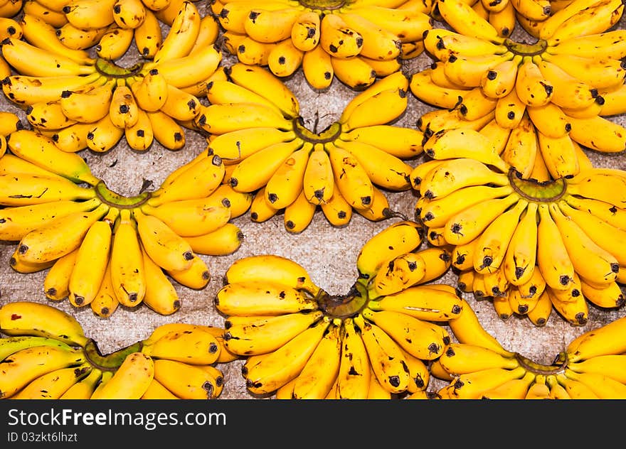 A lot of egg bananas on the floor. A lot of egg bananas on the floor.