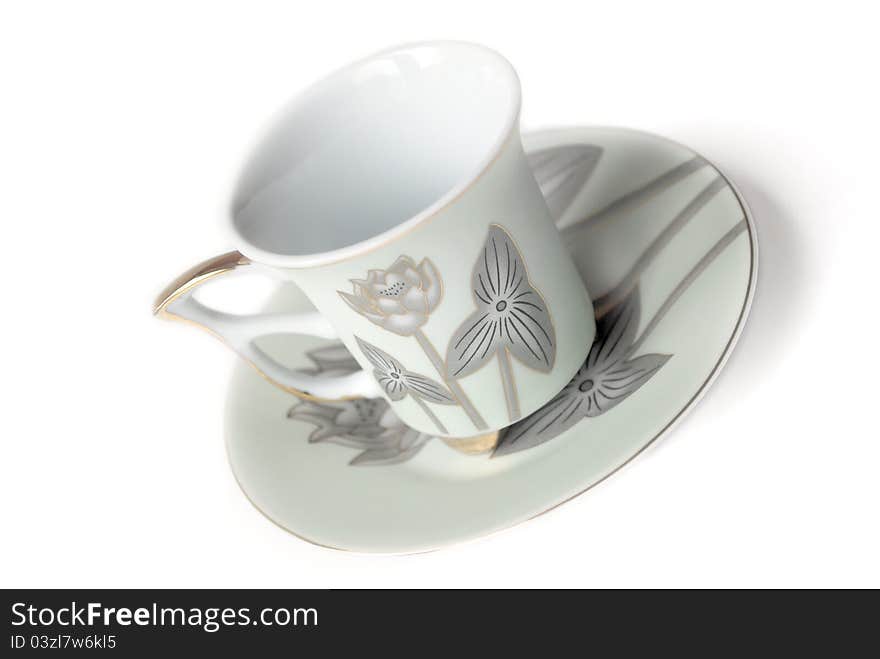 Empty cup and saucer  with pattern isolated