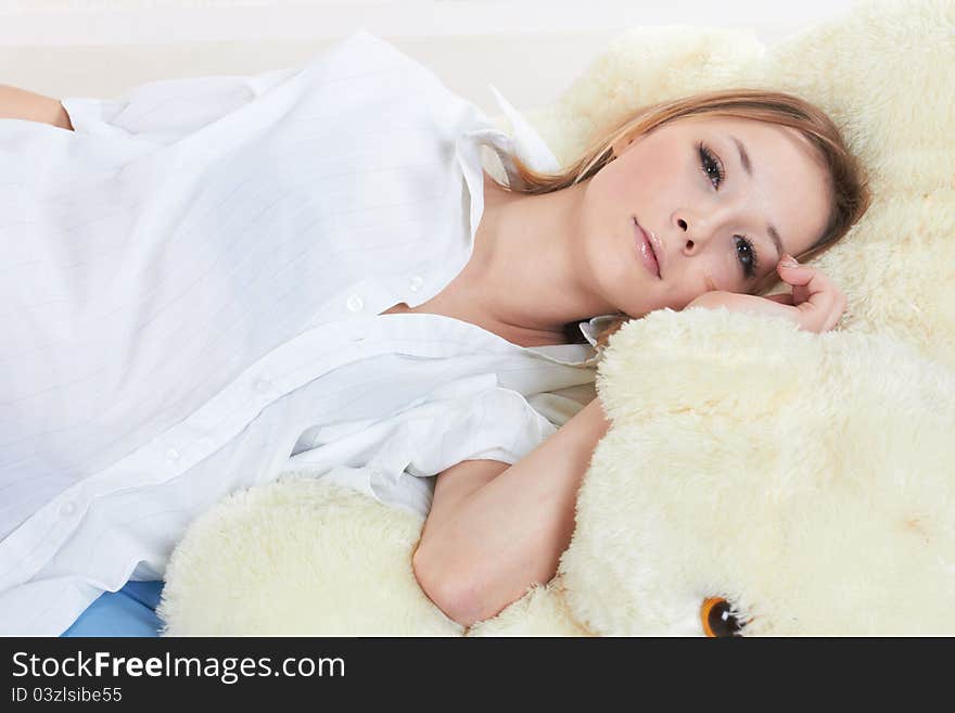 A face of a young beautiful woman resting in the bed