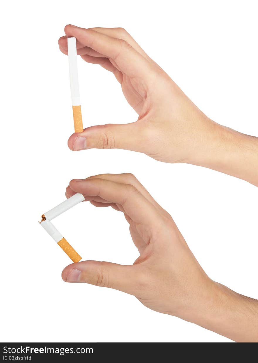 Mans hand breaking and holding a cigarette it is isolated on a white background.