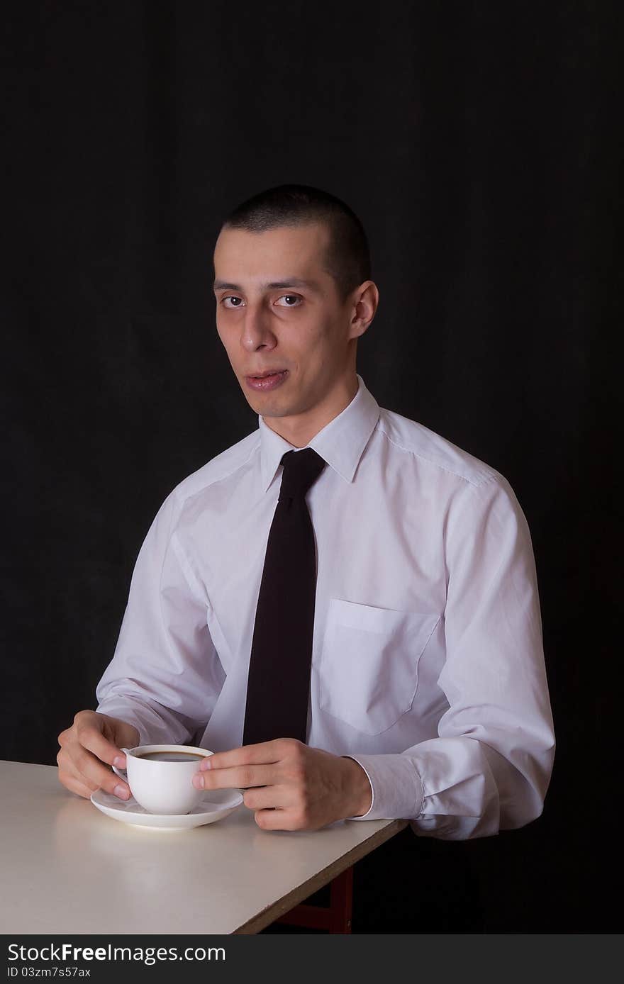 Suspiciuos Businessman Drinking Coffee