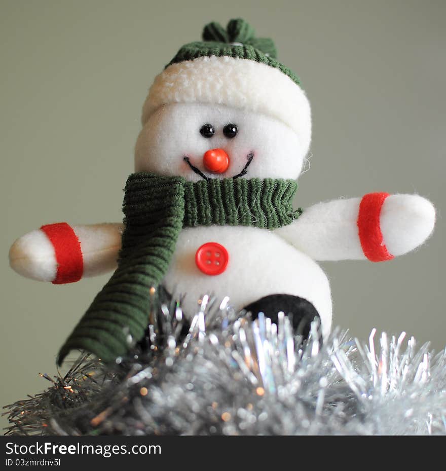 Cheerful snowman in hat