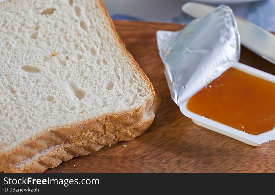 Delicious breakfast with bread and peach jam. Delicious breakfast with bread and peach jam