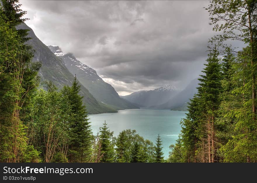 Rainy weather overr lake Lovatnet in Jostedalsbreen national park, Norway. Rainy weather overr lake Lovatnet in Jostedalsbreen national park, Norway