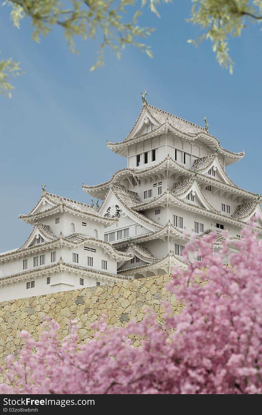 Japanese pagoda building, viewed from a lower level, with plants in the foreground. Japanese pagoda building, viewed from a lower level, with plants in the foreground.