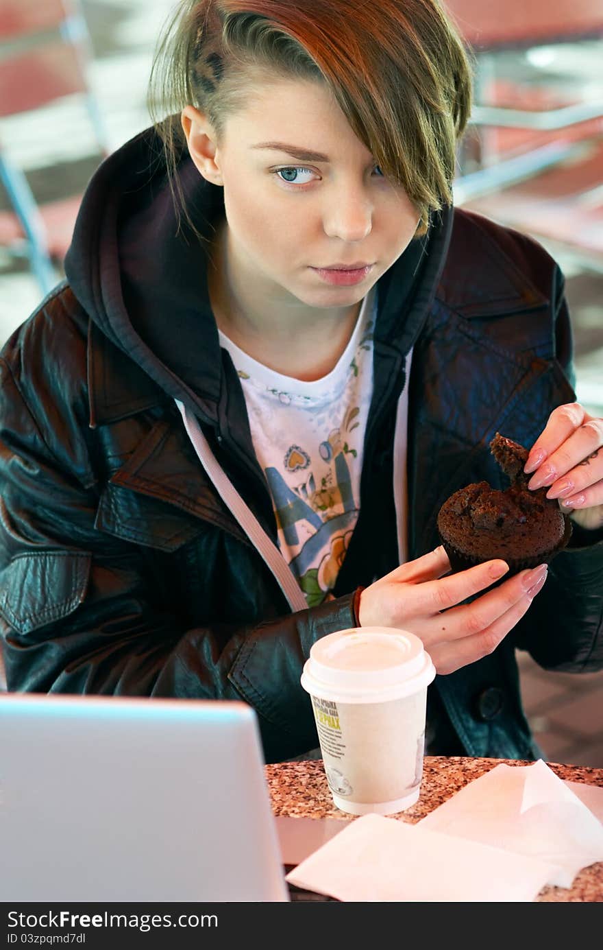 Girl With Cup And Muffin On The Terrace