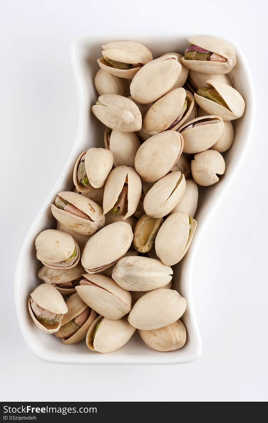 Pistachios on the white plate