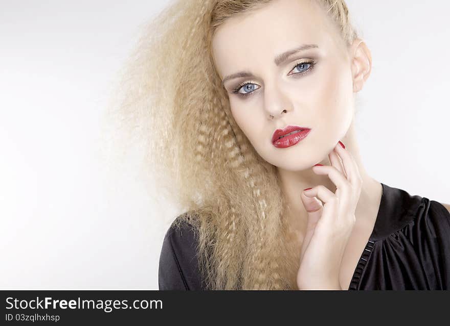 Young pretty woman with beautiful blond hairs and multicolor makeup isolated on white background