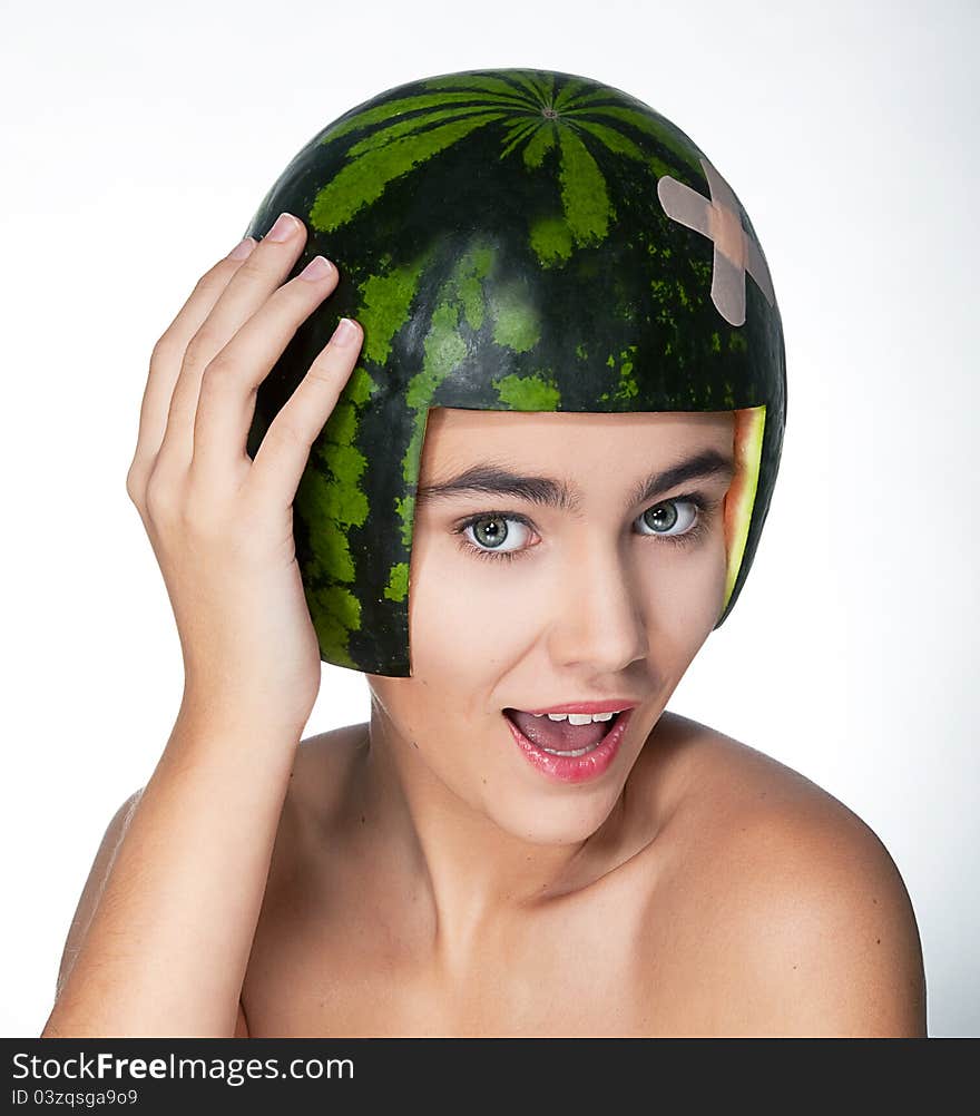 Funny young pretty female in helmet - fresh melon