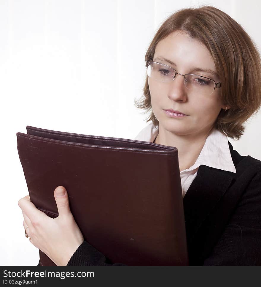 A businesswoman with glasses and clipboard