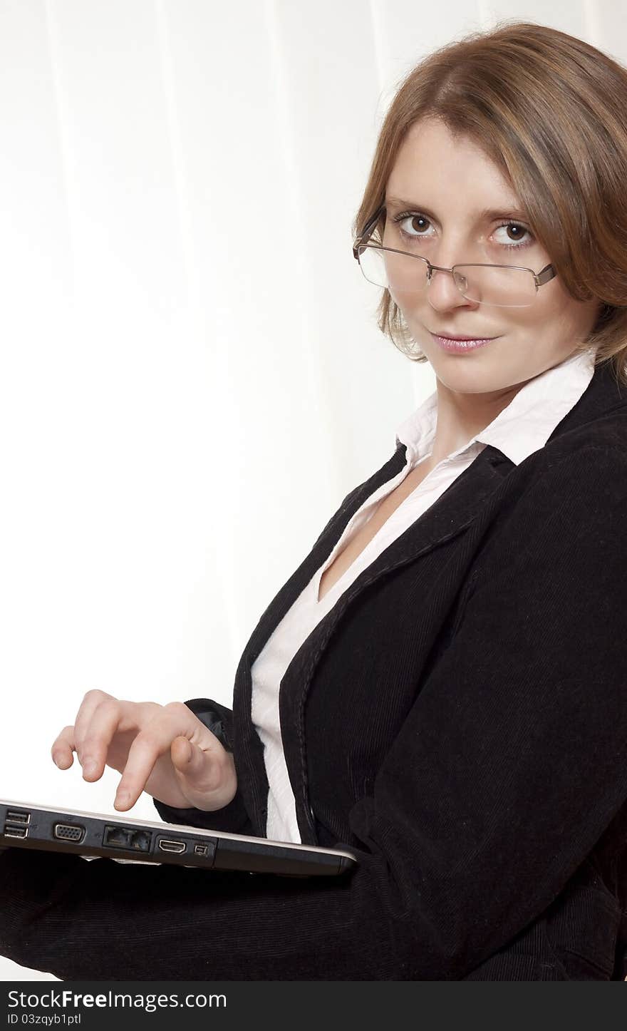 A businesswoman with glasses and laptop