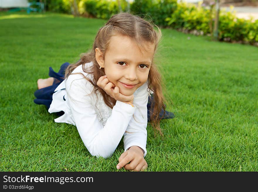 Girl lying on the lawn