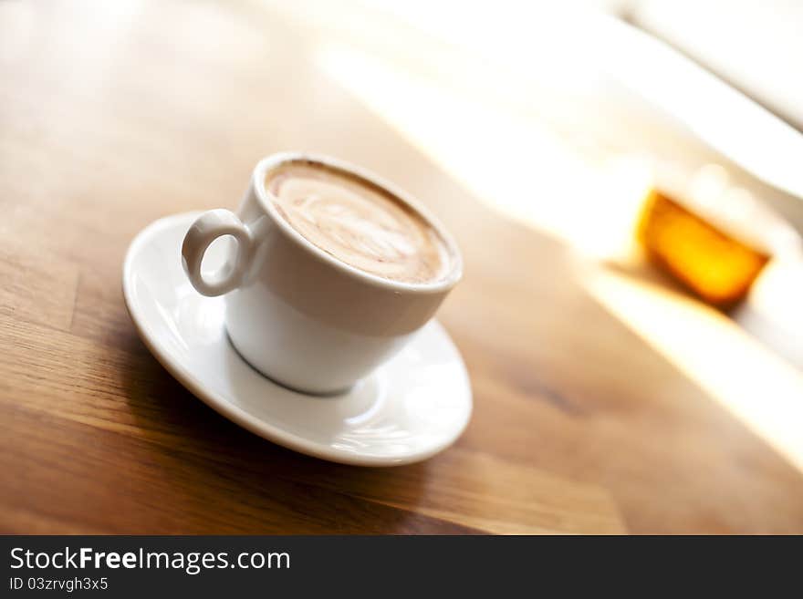 Small cup of coffee on a table