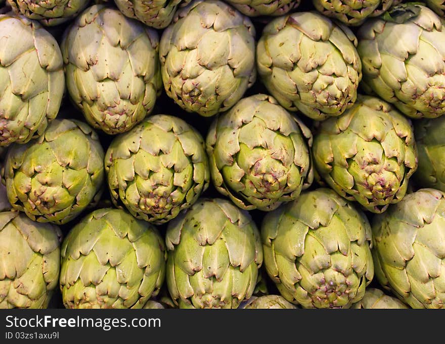 Freshly picked artichokes on display at the farmers market Boqueria, Barcelona.