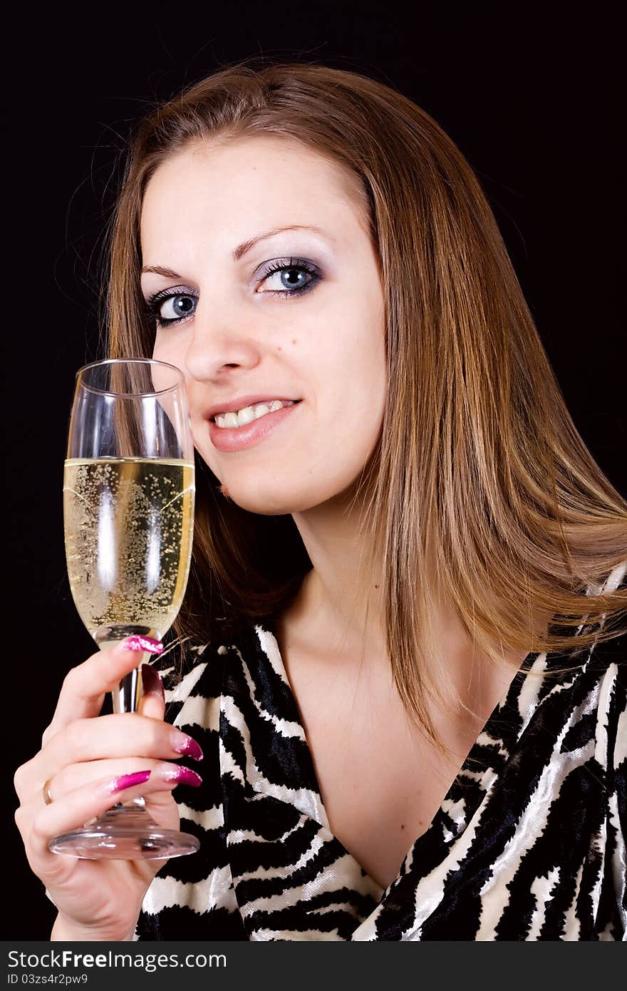 Beautiful woman enjoying a glass of pink champagne. Beautiful woman enjoying a glass of pink champagne