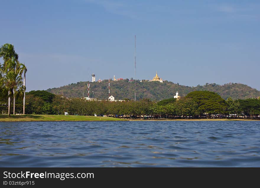 Temple on a hill looking over water in the Province of Thailand. Temple on a hill looking over water in the Province of Thailand.