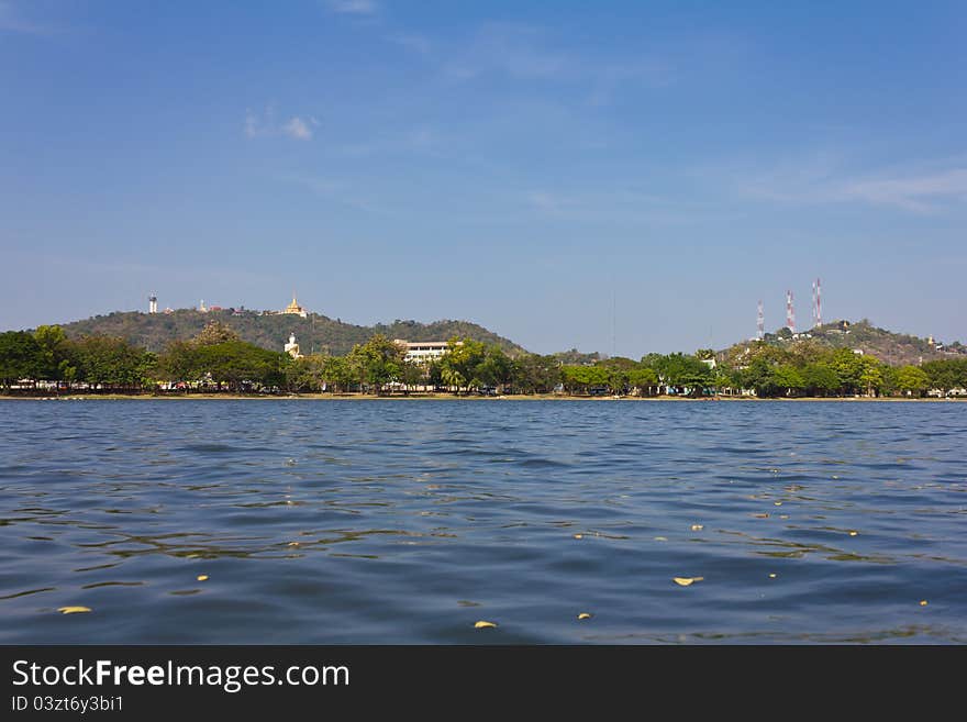 Temple on a hill looking over water in the Province of Thailand. Temple on a hill looking over water in the Province of Thailand.