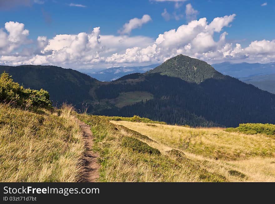 Summer sunny landscape with a cloudy sky. Ukraine, the Carpathian mountains. Summer sunny landscape with a cloudy sky. Ukraine, the Carpathian mountains.