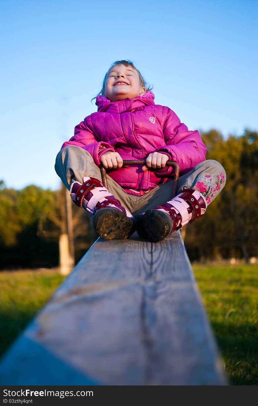 Girl riding on a swing