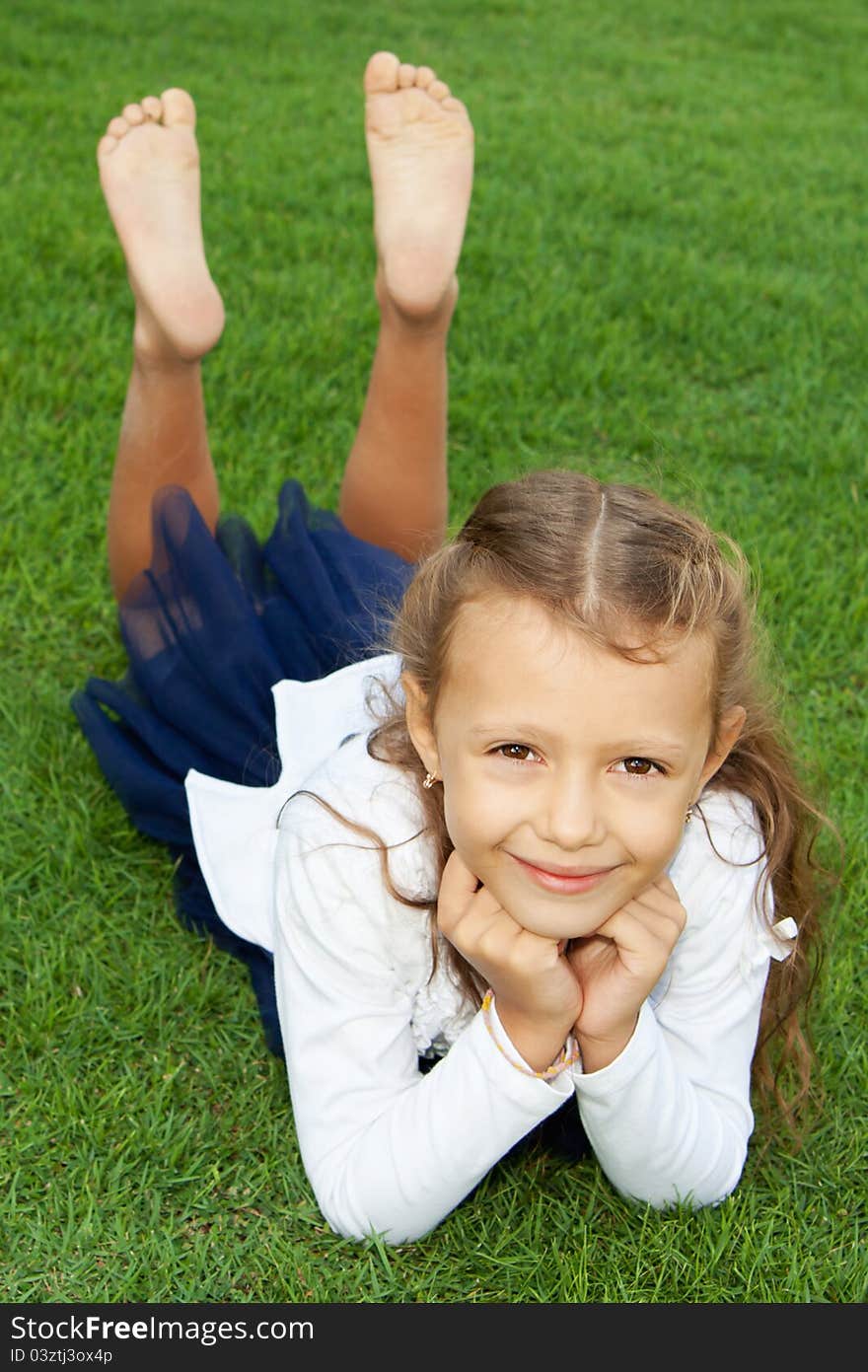 Girl lying on the lawn