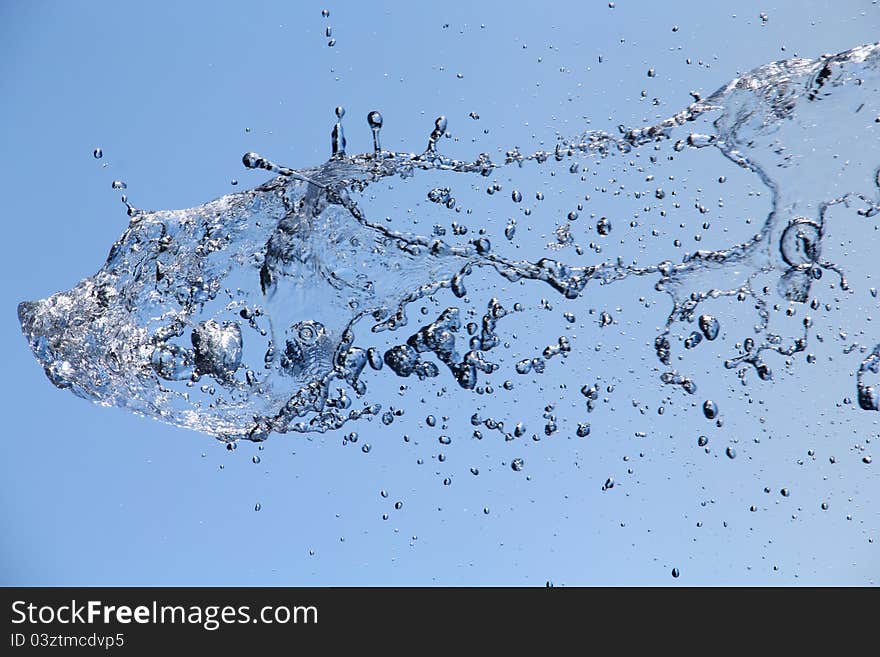 Freeze water fountain against blue sky