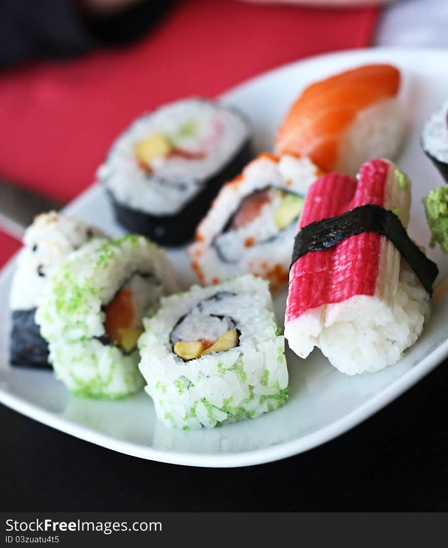 Japanese sushi on a white plate.