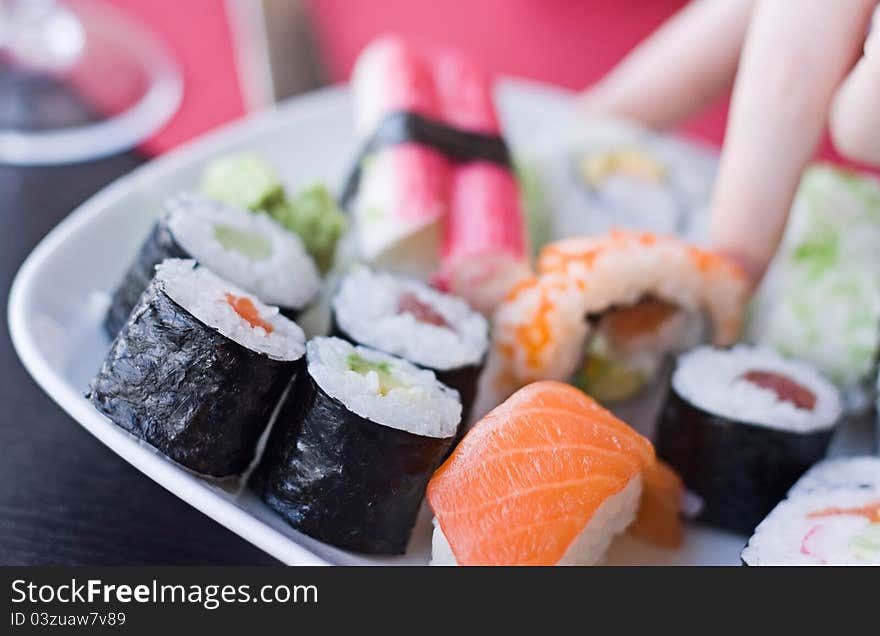 Japanese sushi on a white plate. Japanese sushi on a white plate.