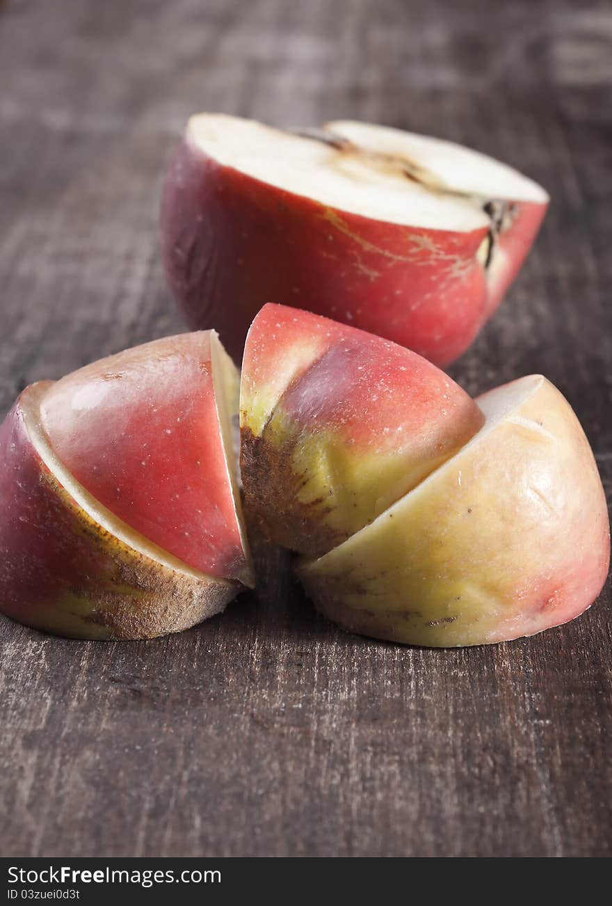 Sliced ​​apples on old wooden table