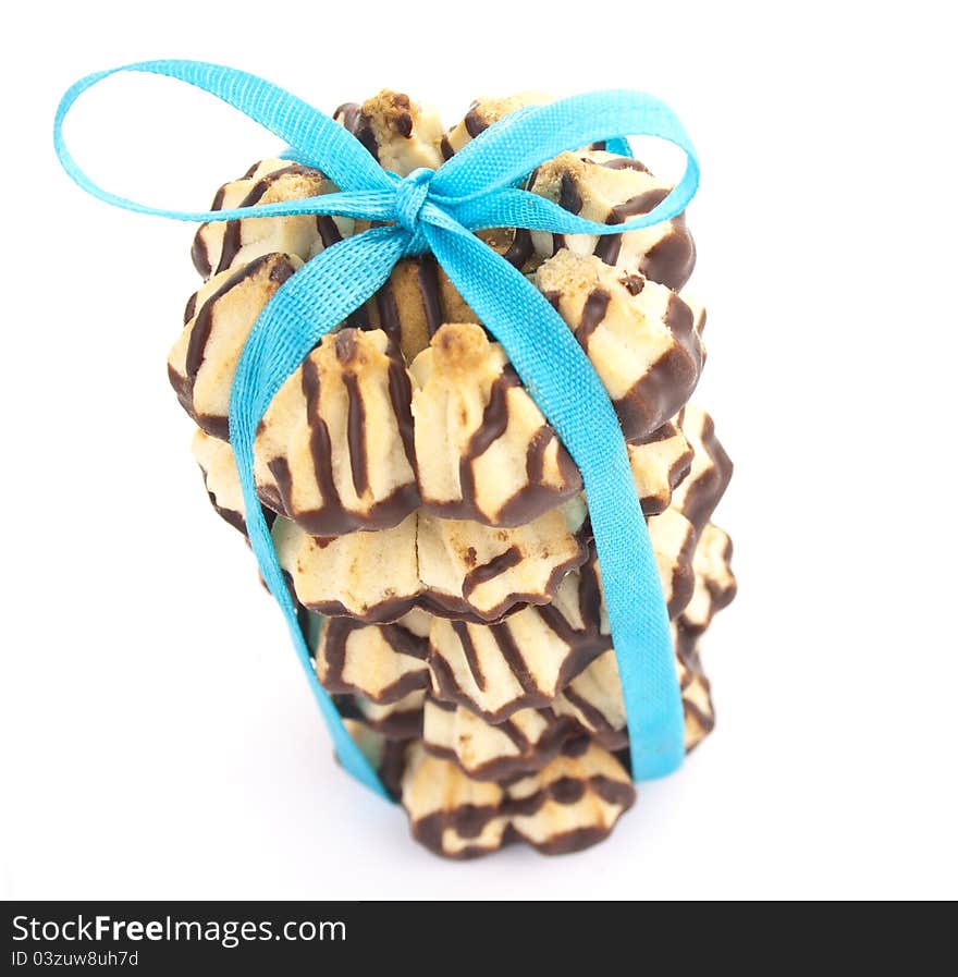 Cookies in blue ribbon isolated  on white