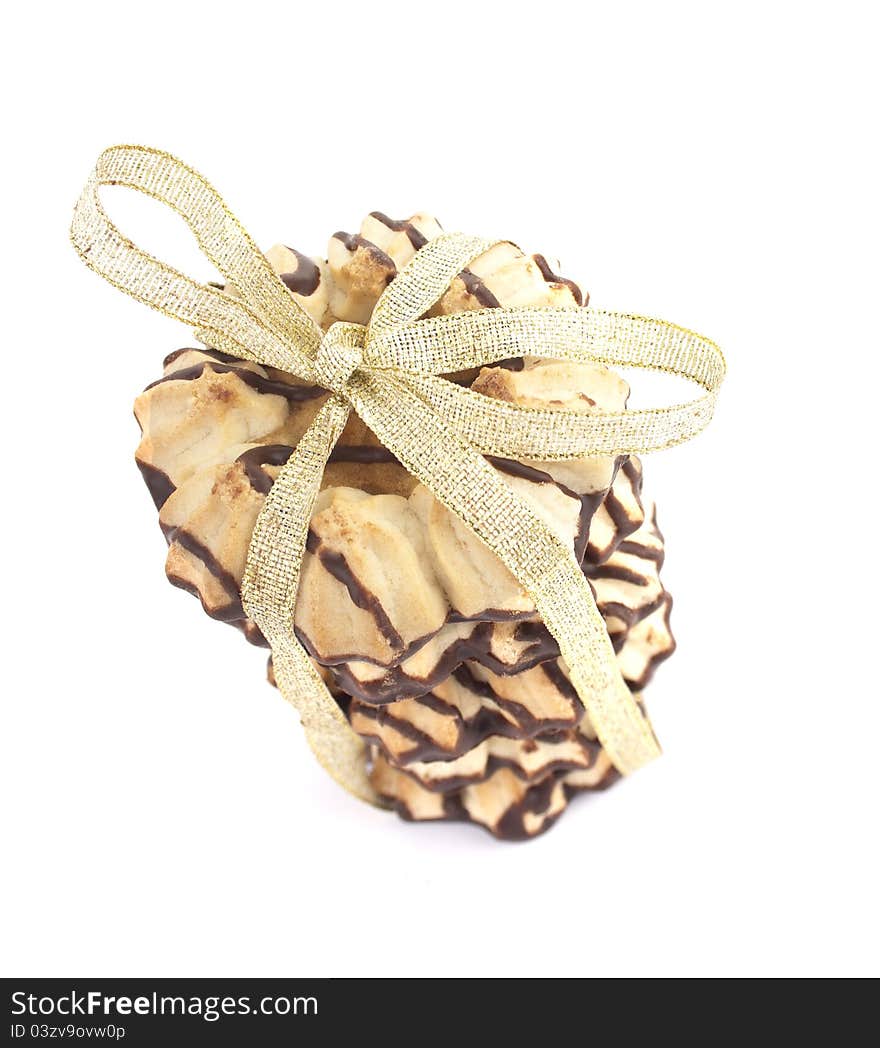 Cookies with decorative gold ribbon on white background. Cookies with decorative gold ribbon on white background