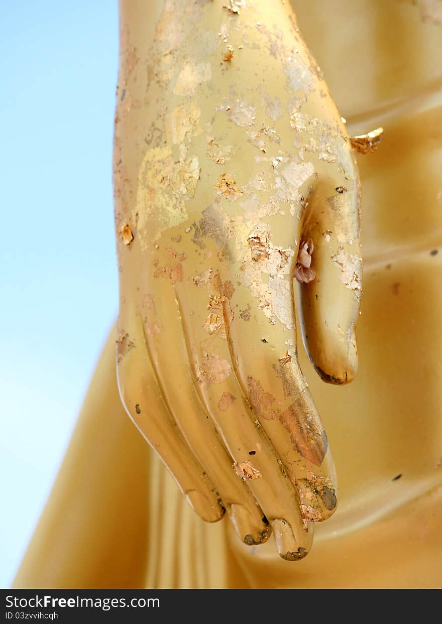 Golden Hand of the Buddha statue with some gold leaf