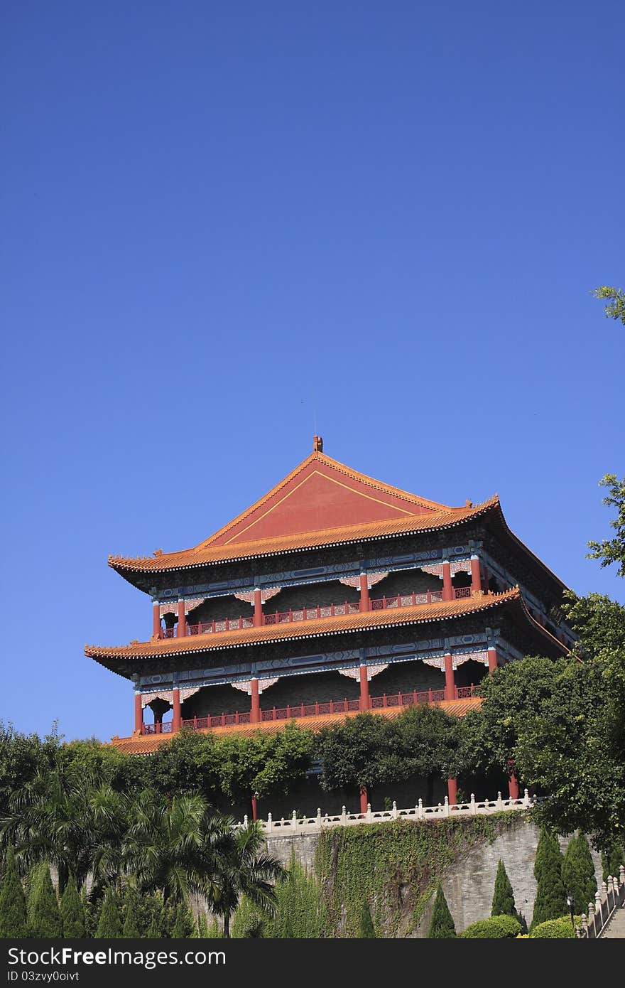 An orange Chinese temple pagoda in  Guangzhou China.