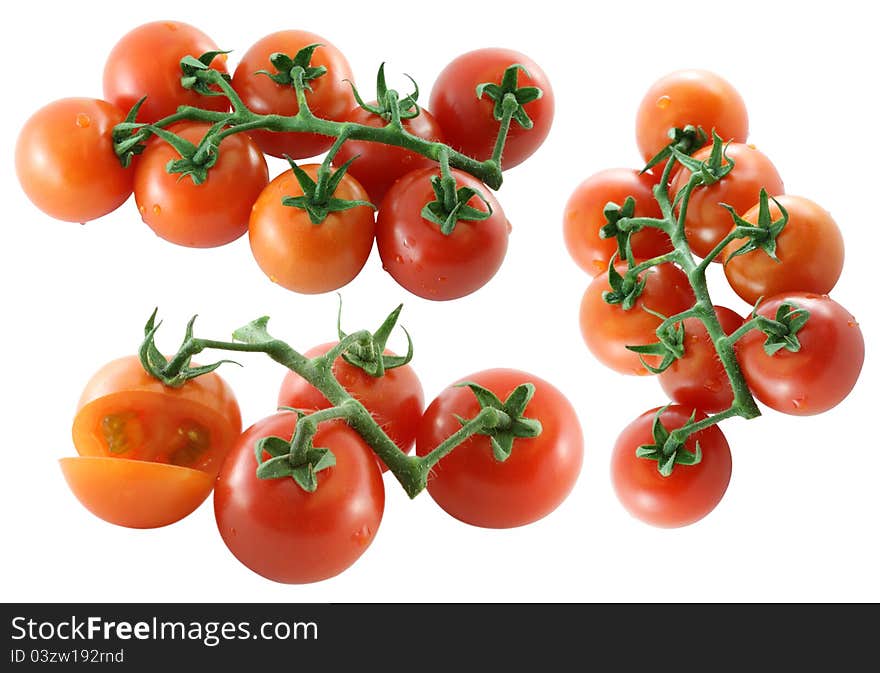 Closeup photo of 3 branches of fresh Cherry tomato on white background