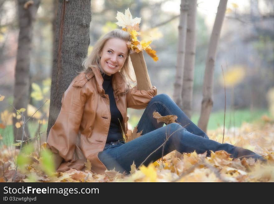 The girl on a walk in the autumn park