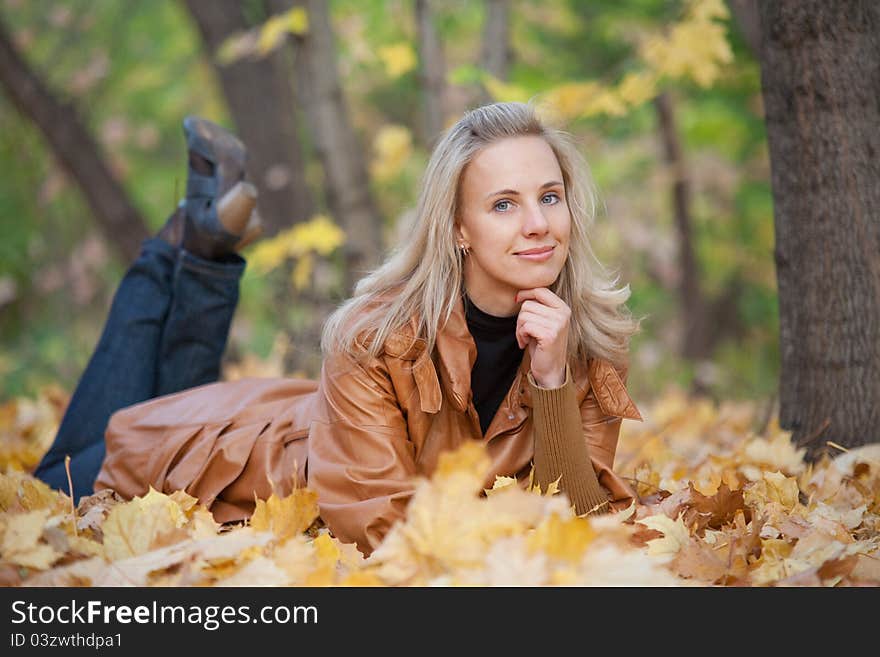 The girl on a walk in the autumn park