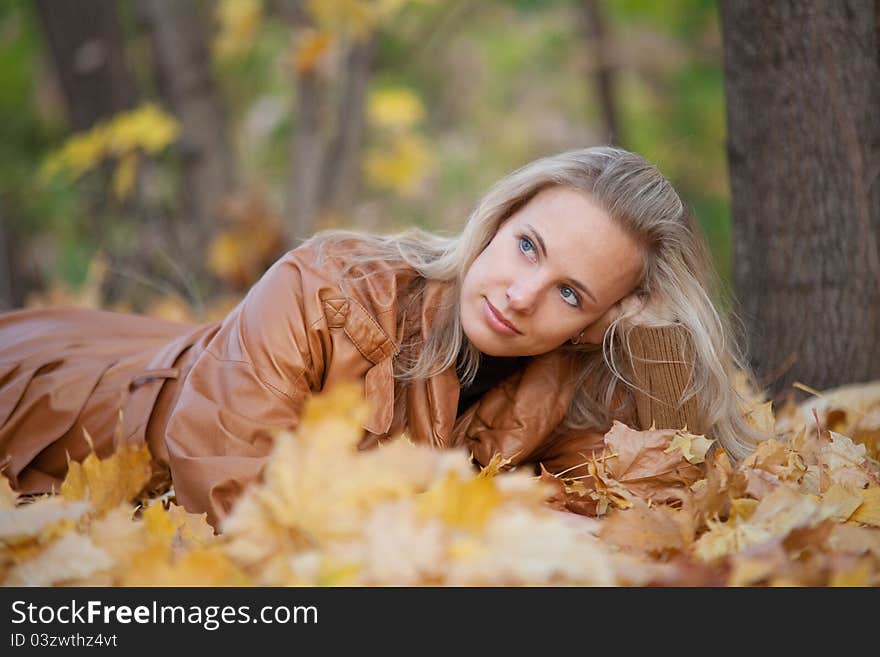 The girl on a walk in the autumn park