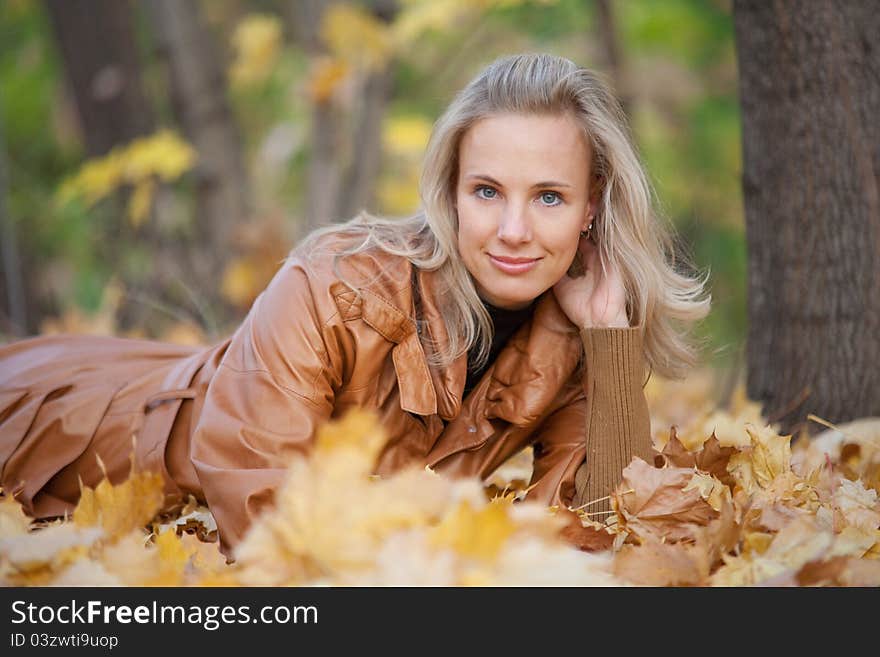 The girl on a walk in the autumn park