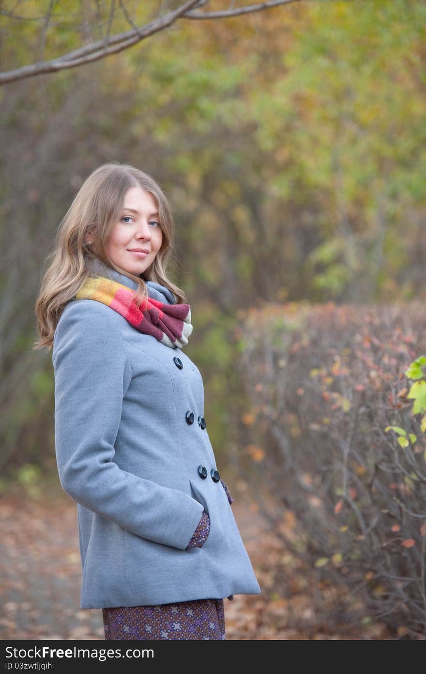 The girl on a walk in the autumn park