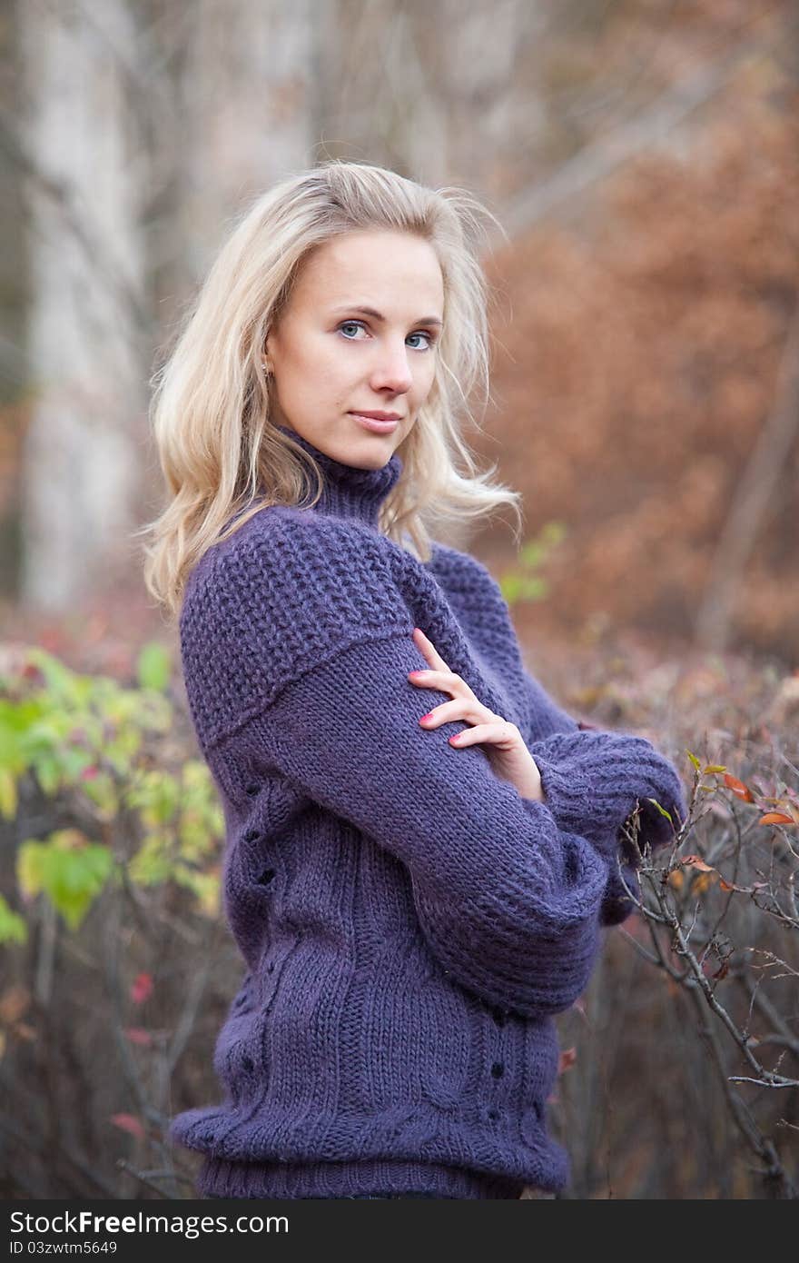 The girl on a walk in the autumn park