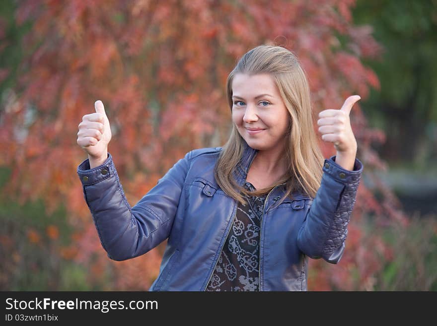 Pretty positive girl with thumbs up