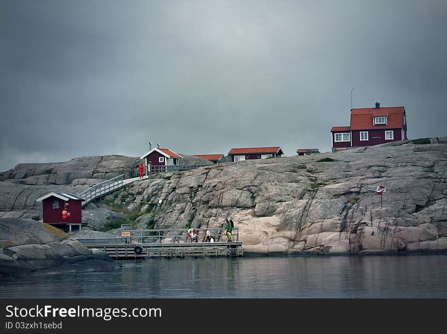 Small houses on little island on west coast in Sweden