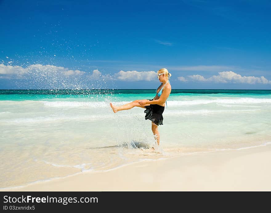 Woman on a White Sand Beach