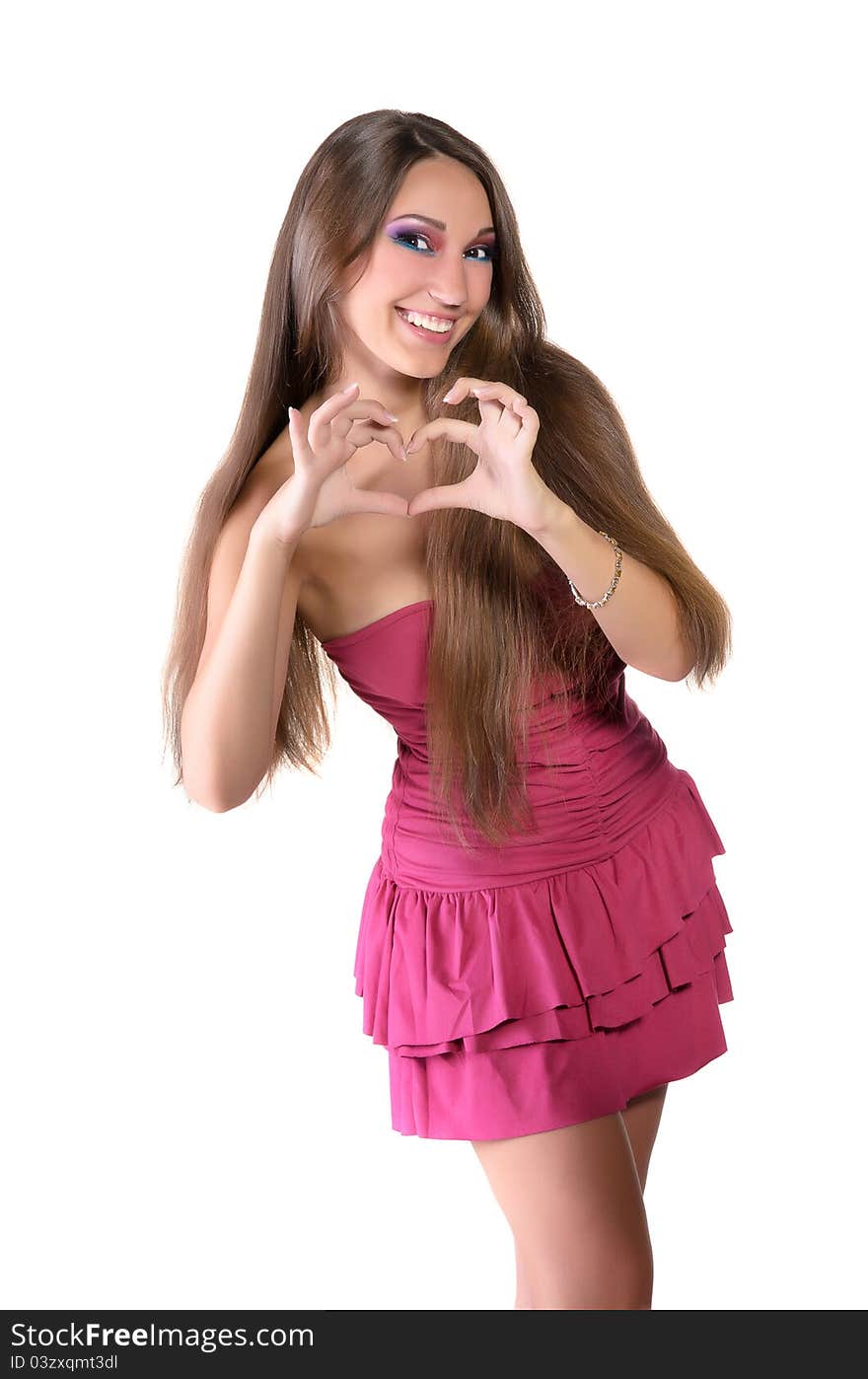 Girl in pink dress, shows the heart