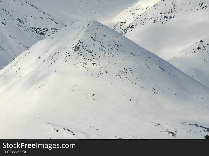 Snowy Pyramidal Mountain in Broad Pass, Alaska