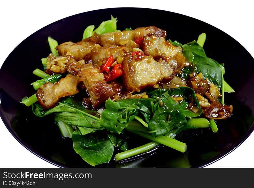 Thai stir fried chinese kale with crispy pork