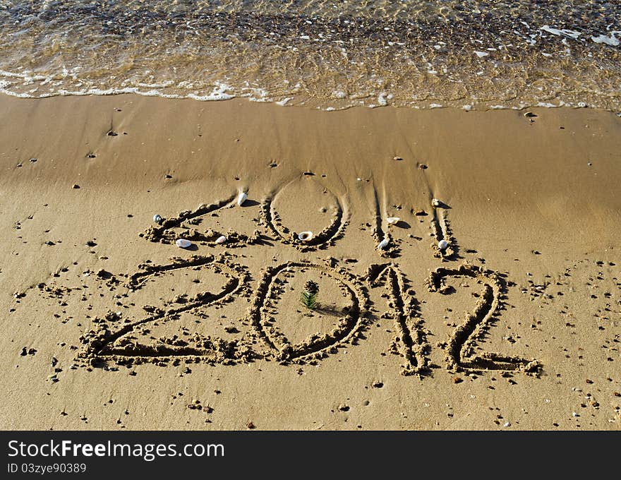 Message of 2012 New Year has came on the gold sandy beach of the Red Sea near Eilat. Message of 2012 New Year has came on the gold sandy beach of the Red Sea near Eilat