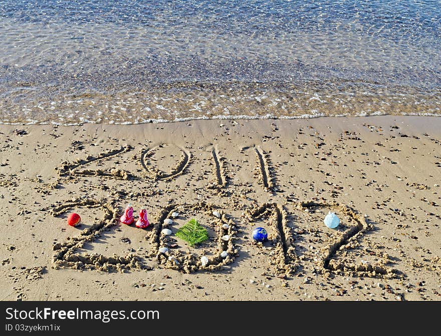 Message of 2012 New Year has came on the gold sandy beach of the Red Sea near Eilat. Message of 2012 New Year has came on the gold sandy beach of the Red Sea near Eilat