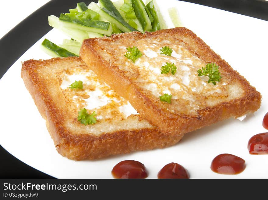 Toasted white bread with an egg on a plate