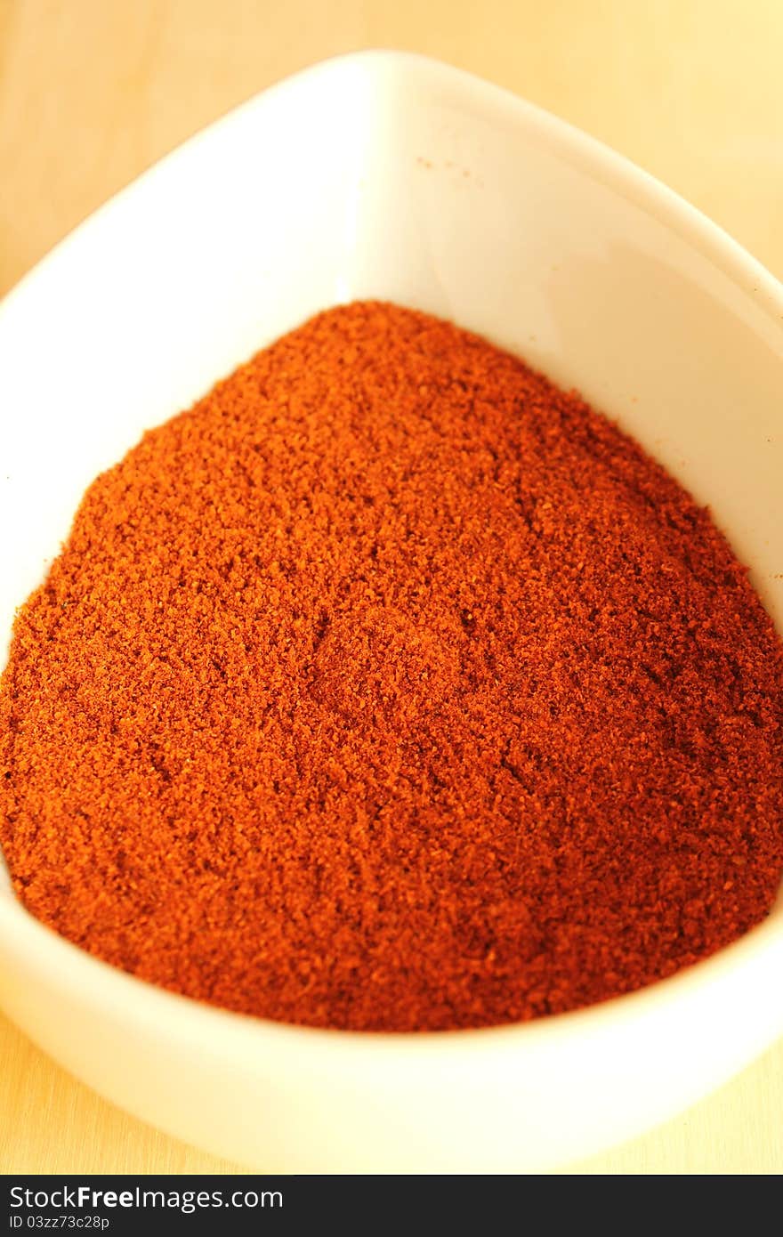 Close-up of dry paprika in a white bowl